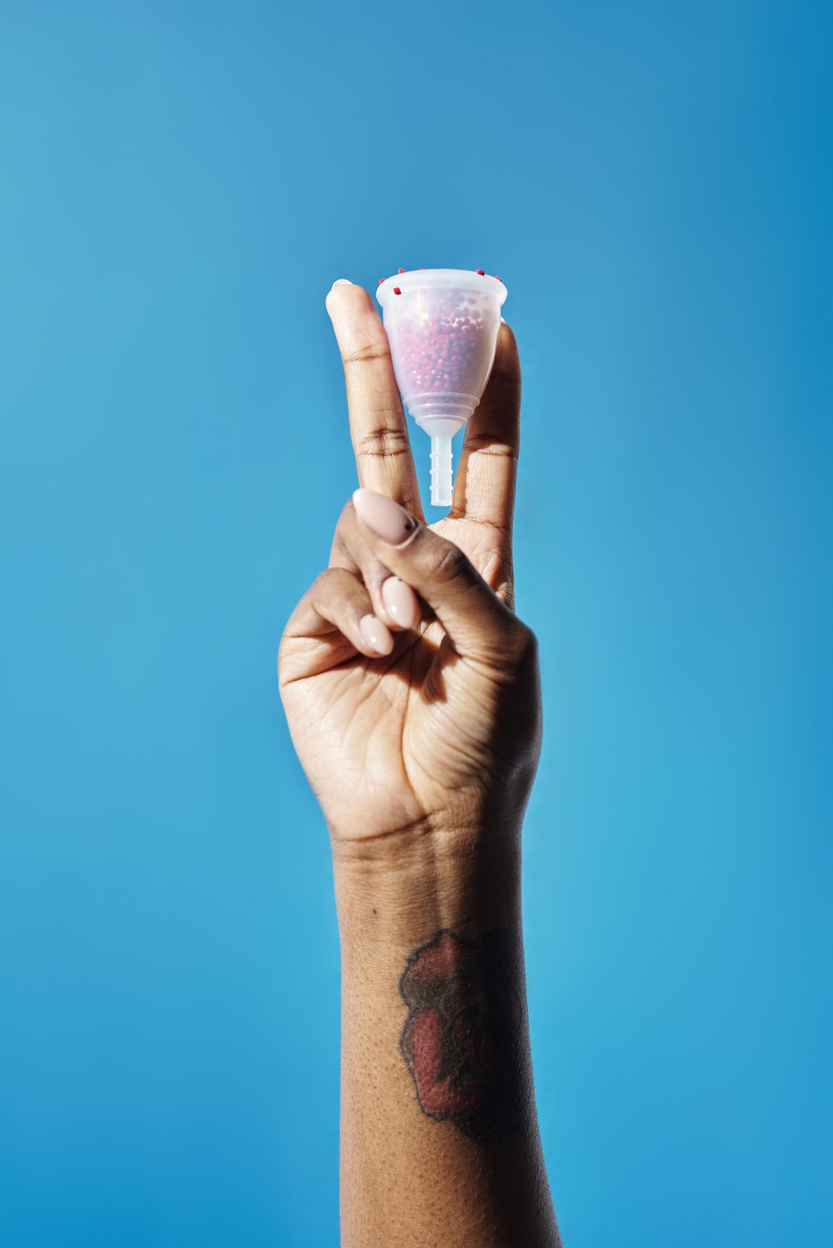 Person holding menstrual cup